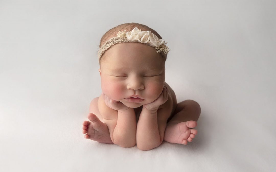 froggy pose on white background newborn photo illustrating newborn safety