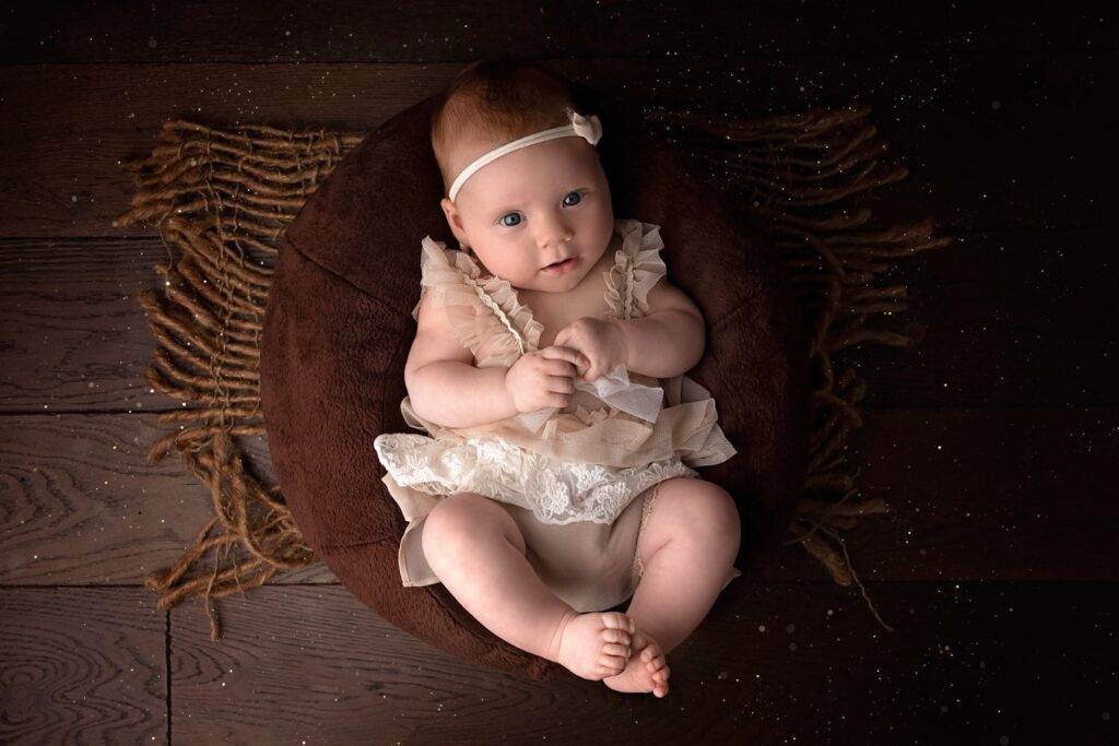 Older Newborn in outfit, smiling